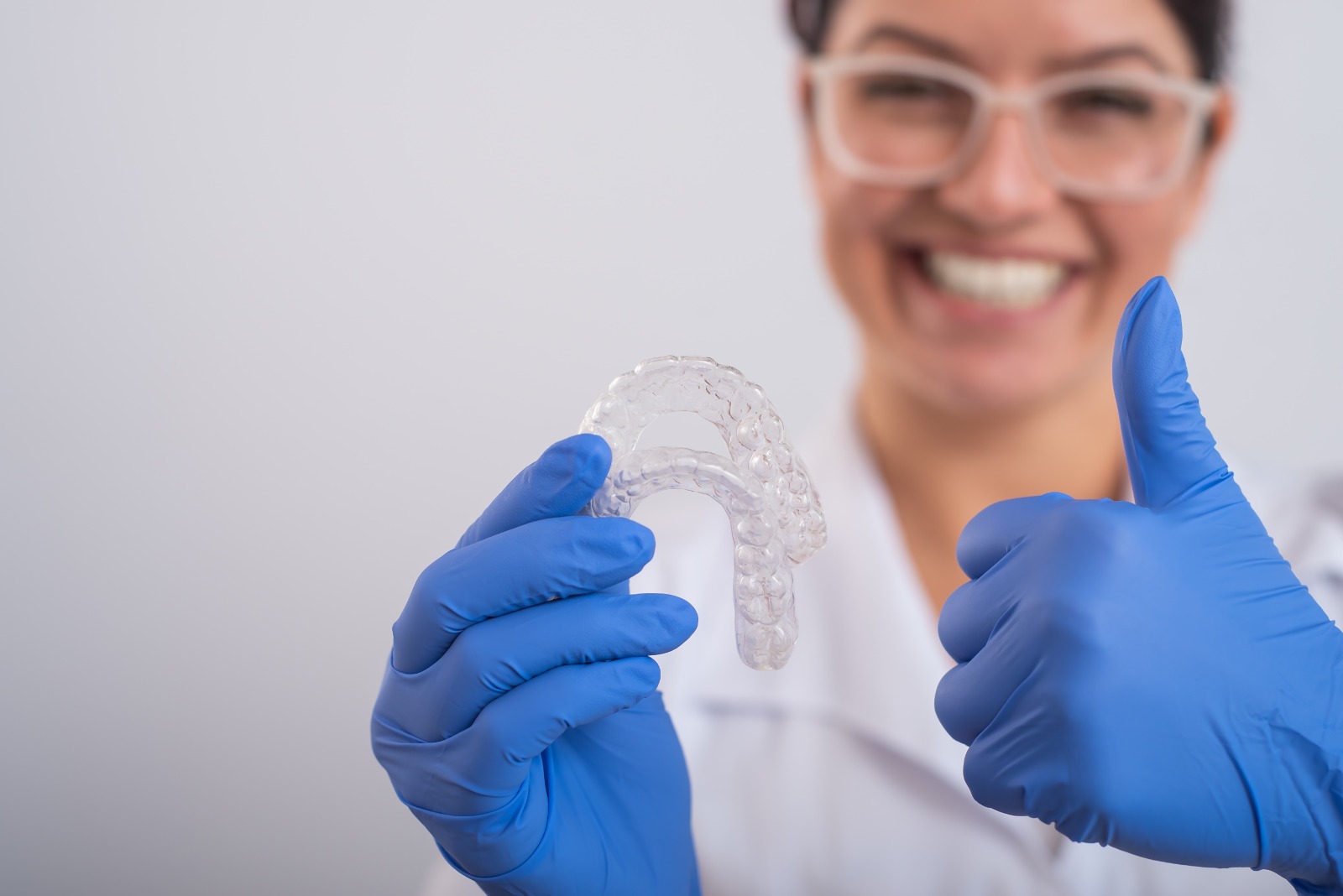 Patient smiling after invisible clear aligners treatment at Aira Dental Clinic in Kokapet